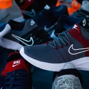Diverse array of athletic shoes showcased in vibrant colors and various styles.